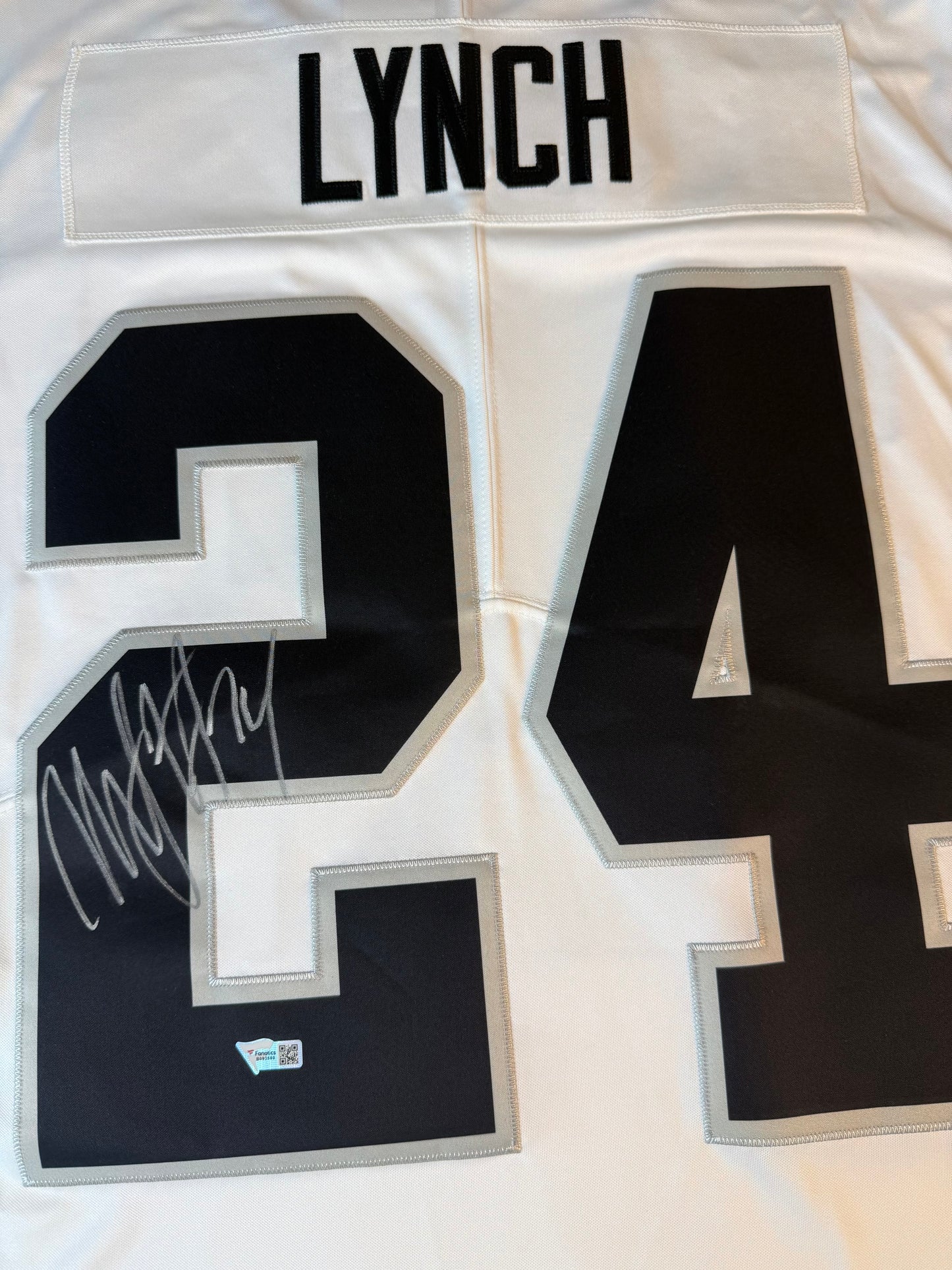Marshawn Lynch Raiders #24 Autographed Nike White Game Jersey Closeup