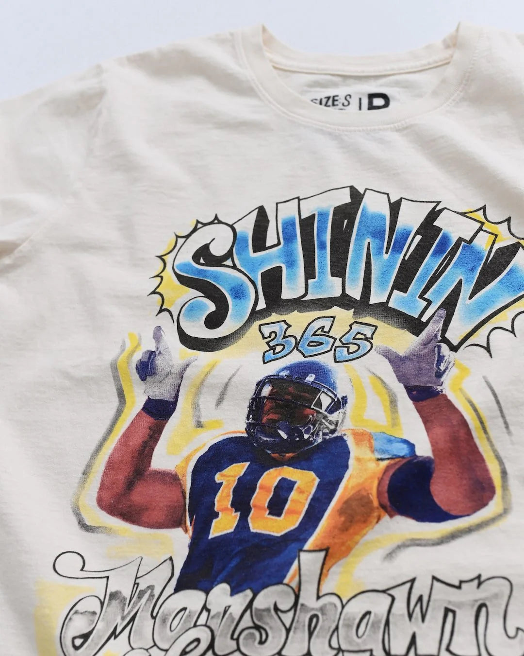 Marshawn Lynch x Roots of Fight CAL Shinin' 365 Tee Close up