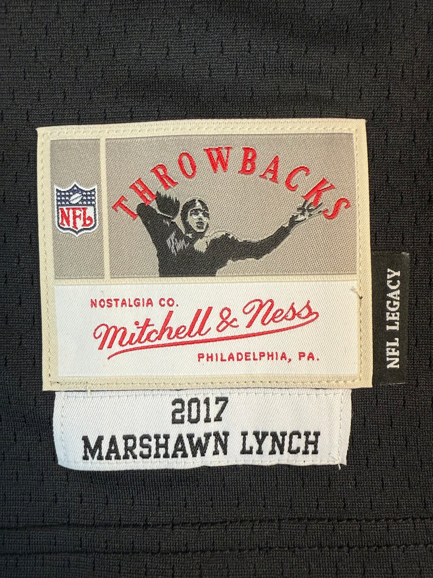 Mitchell & Ness Marshawn Lynch Oakland Raiders 2017 Legacy Player Jersey (Autographed) Label