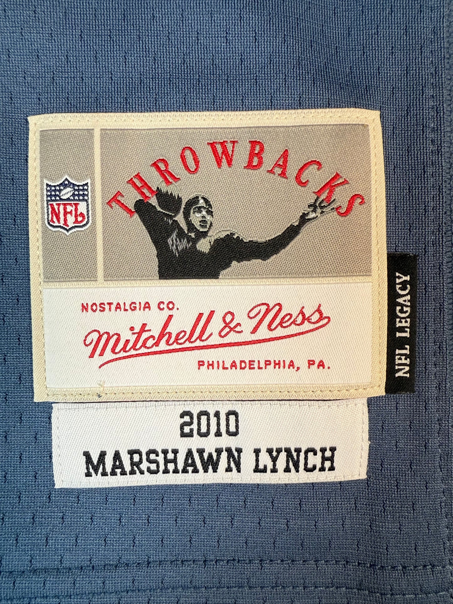 Mitchell & Ness Marshawn Lynch Seattle Seahawks 2010 Legacy Player Jersey (Autographed) Label